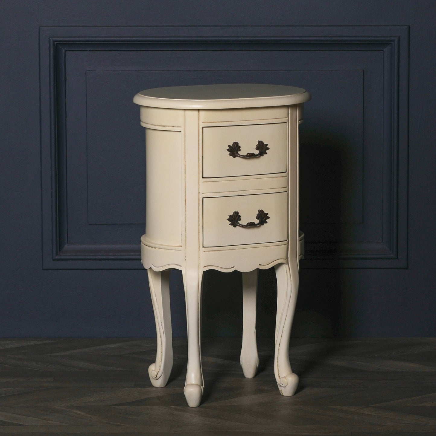 Aged ivory oval bedside Table