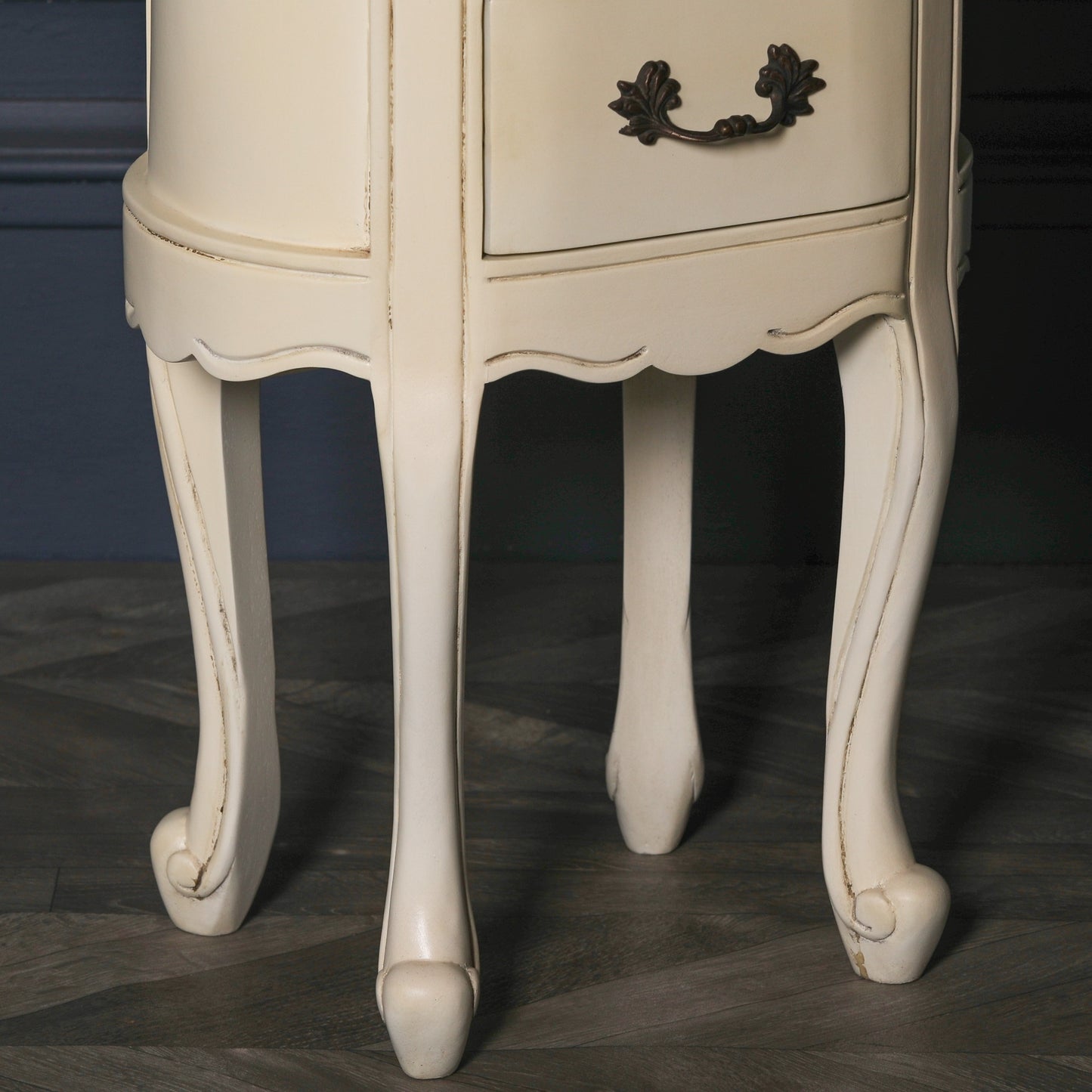 Aged ivory oval bedside Table