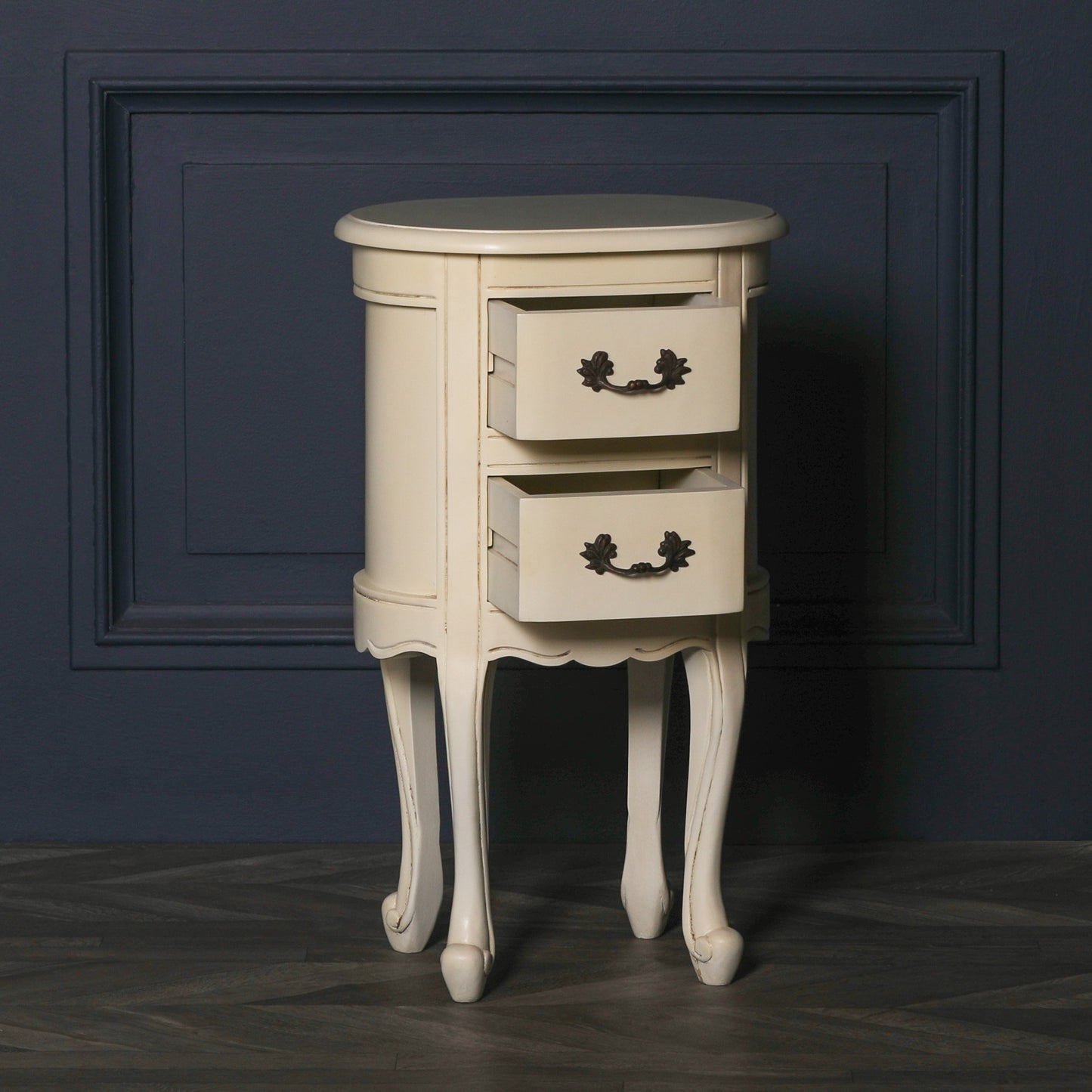Aged ivory oval bedside Table