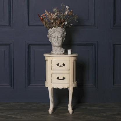 Aged ivory oval bedside Table